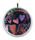 Sample of large round pendant from Annette Ragone Hall's "In The Darkness There Is Light" collection.
